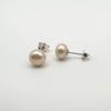 White pearl stud earrings showing side and post detail