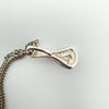 Reverse of diamond pendant stamped 925 with textured silver finish