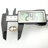 Digital calliper measuring the height of silver Christian oval pendant at 24.6mm