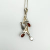 Reverse side of sterling silver pendant with carnelian gemstones