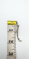 Sterling silver pendant beside ruler showing approx. 55mm length
