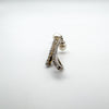 Close-up of CZ-set curved arms on sterling silver pendant