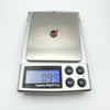 Digital scale showing 0.99g weight of vintage 9ct gold amethyst pendant