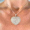 Pavé diamond heart necklace shown worn on neckline