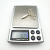 Silver Mother of Pearl necklace shown on scale weighing 3.05g