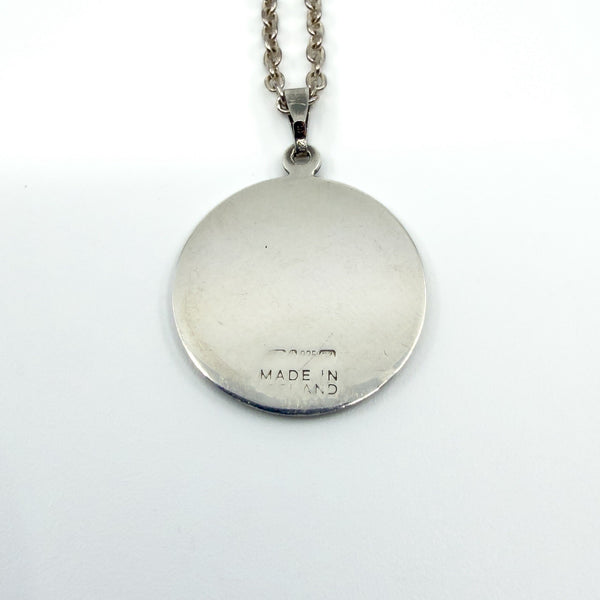 Back of the pendant showing partially worn MADE IN IRELAND stamp and 925 mark.
