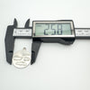 Measuring caliper showing pendant size as 25.8mm in diameter