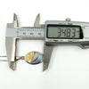 Digital caliper measuring oval pendant length at approximately 34.83mm, sterling silver inlay necklace.