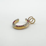 Side angle of antique 9ct gold pendant showing ruby and diamond setting