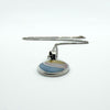 Sterling silver oval inlay pendant with box chain laid flat, showing drop and overall proportion.