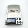 Digital scale showing pendant weight of 2.11g with silver and pearl detail