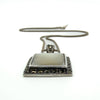 Sterling silver mother of pearl marcasite pendant side view, showing raised setting on chain.