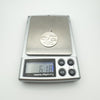 Digital scale showing weight of vintage silver pendant as 6.1 grams