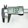 Digital caliper showing width of vintage gold zodiac charm at 13.2mm