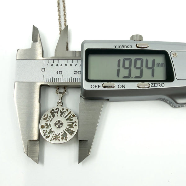 Digital calipers showing 19.94mm width on Irish sterling silver History of Ireland pendant.