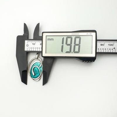 Digital caliper showing pendant width at 19.8mm