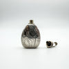 Silver perfume bottle pendant with screw top removed showing inner opening