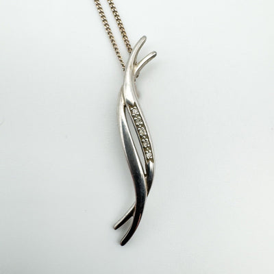 Close-up of five natural diamonds set in silver Hot Diamonds pendant