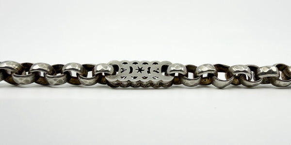 Close up of a pierced star and bar link on an antique Victorian sterling silver Albert chain