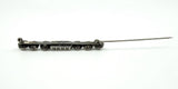 Side view of the paste and pearl bar brooch with pin open, showing the long needle and hinge.