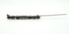 Side view of the paste and pearl bar brooch with pin open, showing the long needle and hinge.