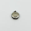 Plain back of vintage sterling silver Virgin Mary photo locket pendant showing surface wear.