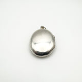Smooth polished reverse side of vintage silver buckle locket