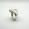 Side angle showing curved polished band on chunky sterling silver ring
