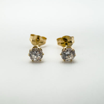 Preloved 9ct gold CZ stud earrings with round cut stones and butterfly backs front
