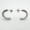 Profile shot showing butterfly posts and full curvature of each chunky hoop