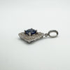 Side profile of sterling silver pendant with round blue CZ