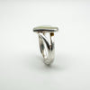 Raised side angle showing depth of heart-shaped mother of pearl ring
