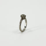 Side view of antique platinum solitaire ring with raised old-cut diamond claw setting
