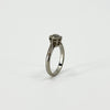 Side view of antique platinum solitaire ring with raised old-cut diamond claw setting
