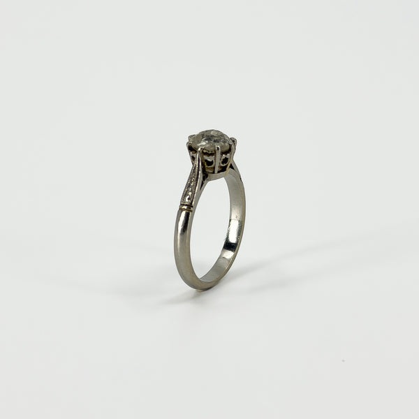 Side view of antique platinum solitaire ring with raised old-cut diamond claw setting