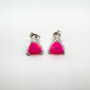 Angled view of neon pink trillion opal earrings in sterling silver