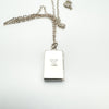 Rear view of hallmarked rectangular sterling silver locket with chain