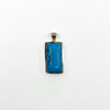 Front view of sterling silver turquoise pendant with rectangular blue stone and black veining