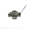 Reverse of giardinetti brooch showing openwork basket design and pin fitting on sterling silver.