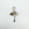 Back view of diamond cross, gold-plated heart and key charm pendant