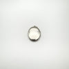 Back of vintage sterling silver locket with smooth polished surface