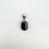 Vintage sterling silver pendant showing solid black agate on reverse side