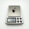 Sterling silver amethyst ring shown weighing 6.6g on digital scale