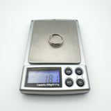 Sterling silver diamond ring displayed on digital scale reading 1.81g