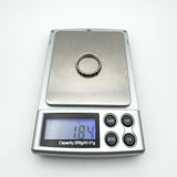 Garnet sterling silver ring weighing 1.84g shown on digital jewellery scale