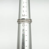 Diamond half hoop ring shown on ring mandrel measuring UK size N