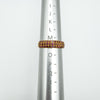 Gold-plated ruby pavé ring shown on ring mandrel, UK size N