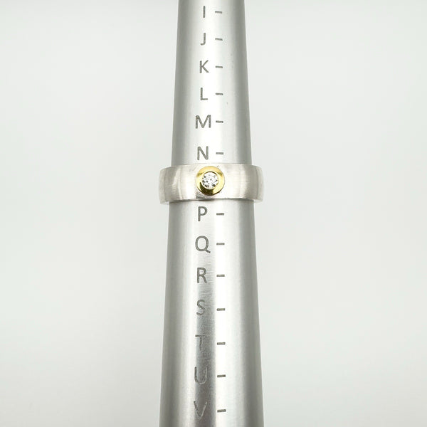 Sterling silver matte band ring shown on ring sizer at size N–O