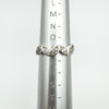 Sterling silver CZ half hoop ring shown at UK size P on sizing mandrel