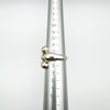 Sterling silver wrap over ring shown on ring sizer, size Q to R